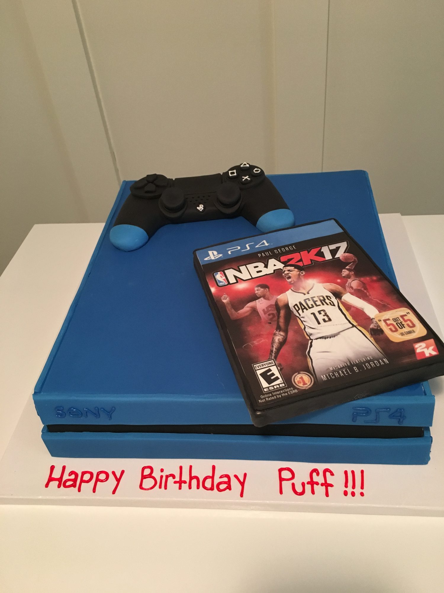 Sculpted PlayStation console cake